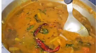 Homemade sambar premix and prepared sambar in a bowl